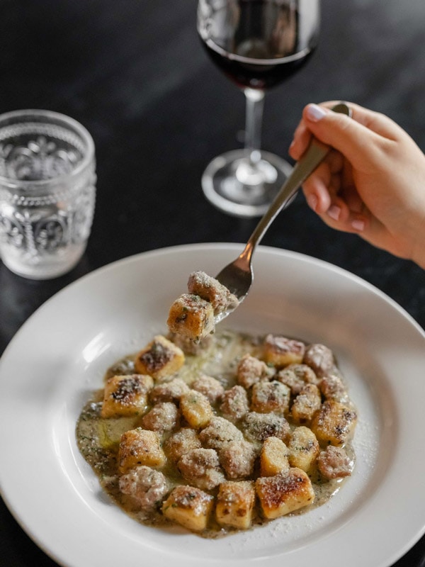 a plate of gnocchi at 1889 Enoteca