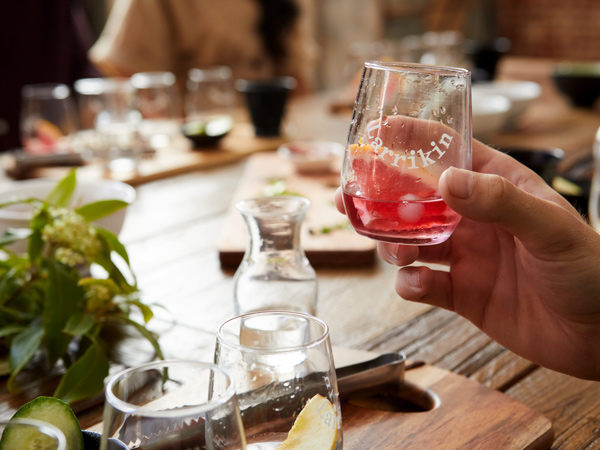 a hand holding a glass of crafted gin at Kilderkin Distillery, Ballarat