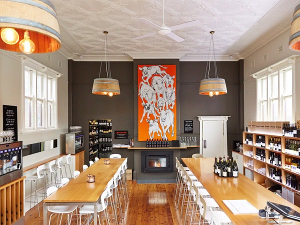 long tables and chairs inside Ferment the Orange Wine Centre.