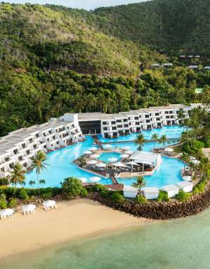 an aerial view of InterContinental Hayman Great Barrier Reef with a pool next to the beach