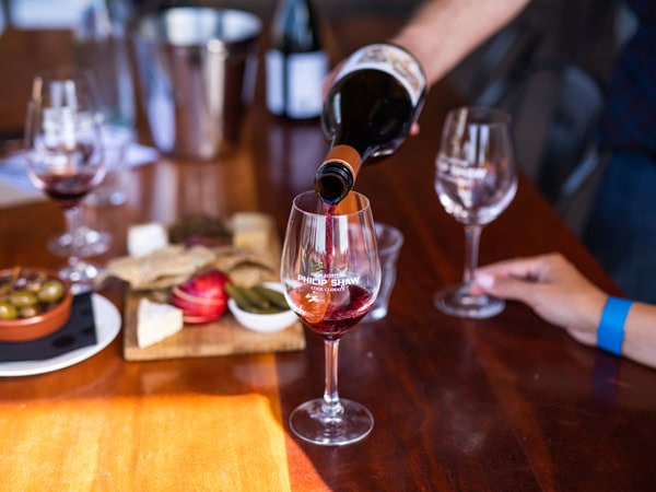 pouring wine into a glass at Philip Shaw Wines' cellar door