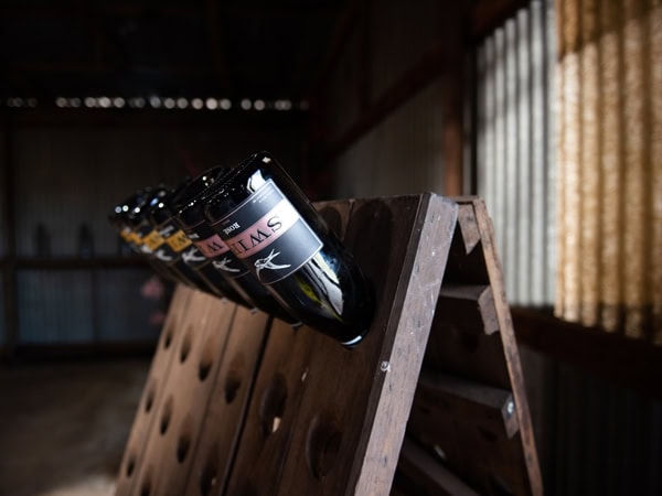 the riddling rack with wine bottles at the cellar door of Printhie Wines