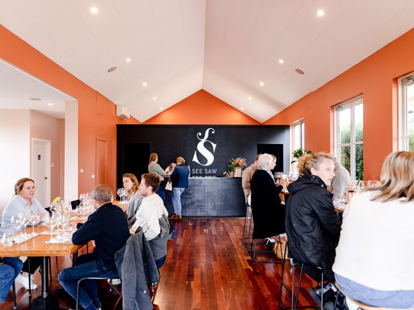 people sitting inside the cellar door of See Saw Wine, Orange