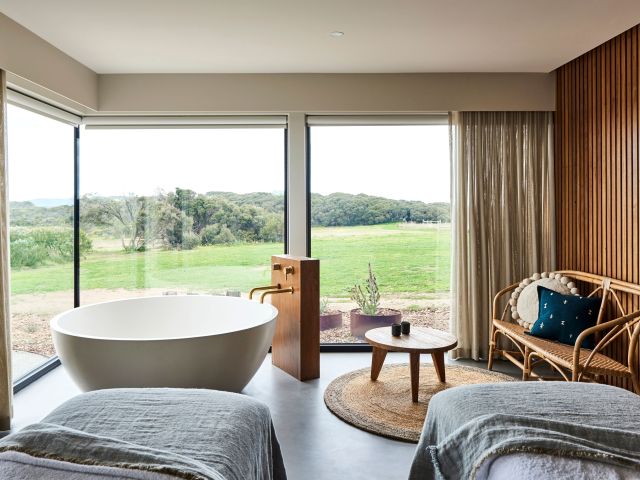 a suite with private tub and lush views at Lon Retreat