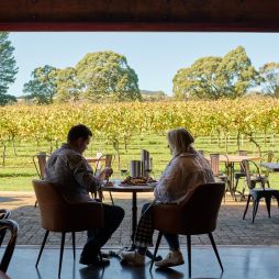 a couple enjoying food and wine at Bendooley Estate, Southern Highlands wineries