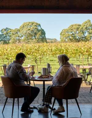 a couple enjoying food and wine at Bendooley Estate, Southern Highlands wineries