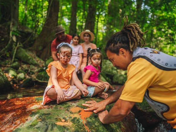 children having their face painted during Walkabout Cultural Adventures