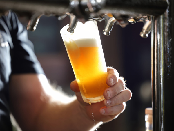 pouring tap beer into the glass at Black Duck Brewery