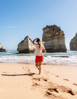 walking barefoot on the sand at at Childers Cove