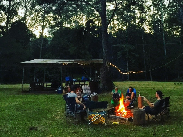 people gathering around the bonfire at Monkey Face Retreat in Arcadia Family Campsite