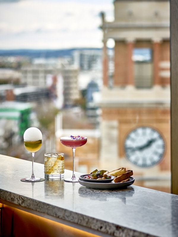 cocktails at Rombergs with a view of the City Hall Clock tower, Newcastle