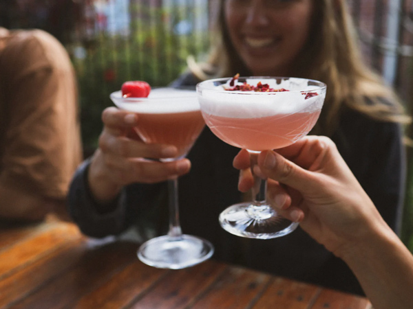 clinking cocktail glasses at Stick Bar, Port Macquarie