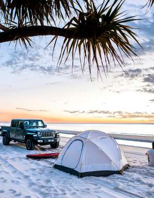 person with 4wd camping on a k'gari beach