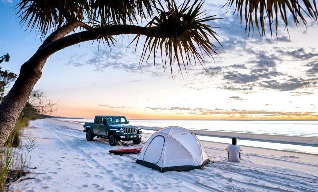 person with 4wd camping on a k'gari beach