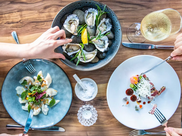 share plates on the table at Melaleuca, Port Douglas