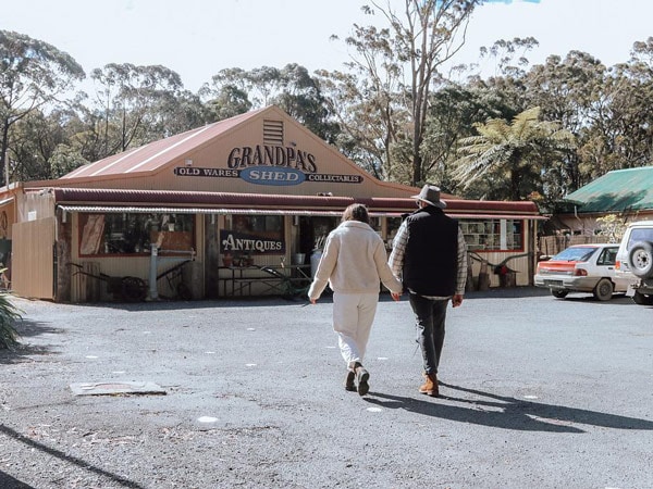 a couple walking towards Grandpa's Shed