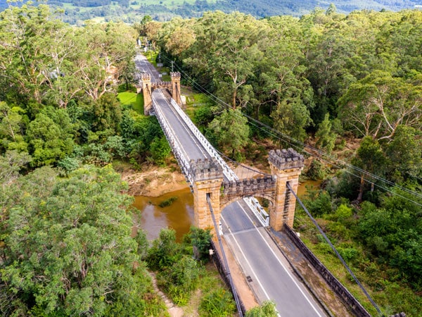 an aerial view of the Hampden Bridge and surrounding landscape