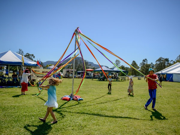 people pulling colourful ropes at the Kangaroo Valley Folk Festival