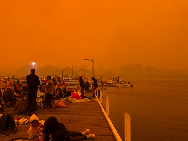 Mallacoota fires: residents on the wharf waiting to be evacuated