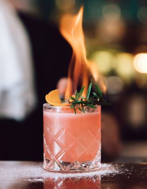 Bartender at Rhonda's in Terrigal making the Burn Baby cocktail
