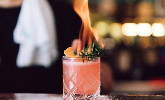 Bartender at Rhonda's in Terrigal making the Burn Baby cocktail