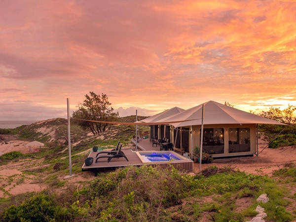 safari tents at Banubanu Beach Retreat during sunset, Northern Territory
