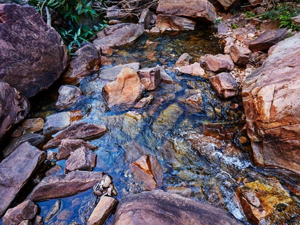 a river flowing through the Emma Gorge hike trail