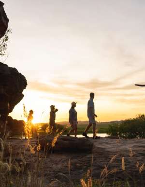 people walking at sunset during Kakadu Cultural Tours