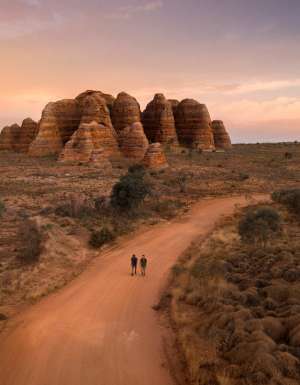 two people walking toward The Bungle Bungle Range, Purnululu National Park