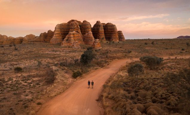 two people walking toward The Bungle Bungle Range, Purnululu National Park