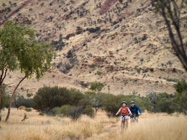 two people biking at Simpsons Gap