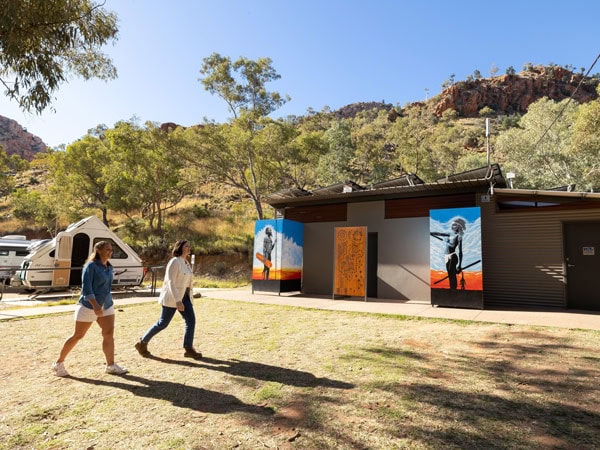 two people walking along the camp facilities at Standley Chasm