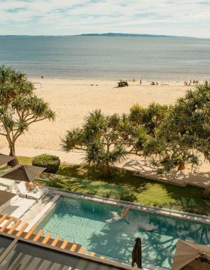 a beachfront swimming pool at Netanya Noosa