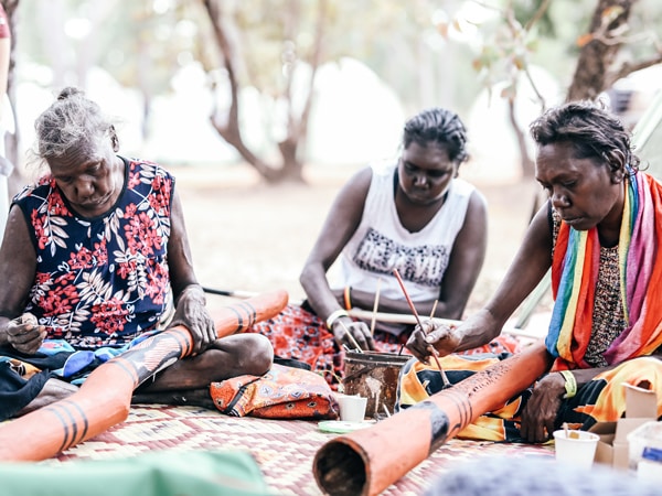 Women painting at Garma