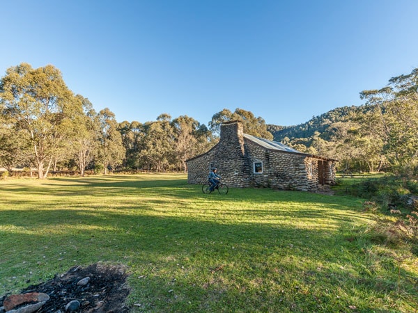 a man biking around the scenic landscape at Geehi Flats