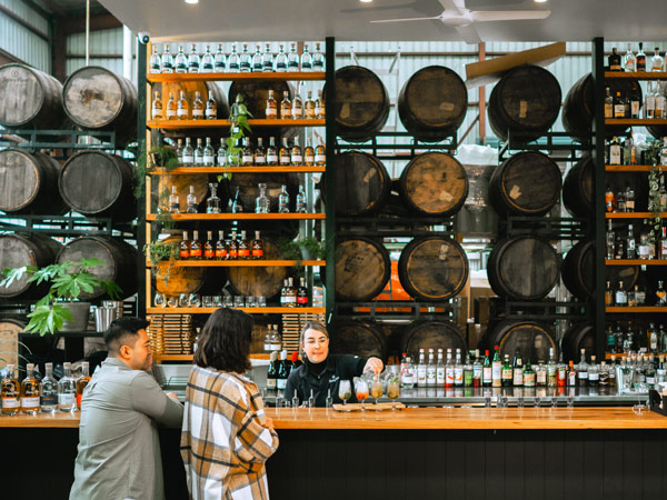 a couple inside JimmyRum Distillery