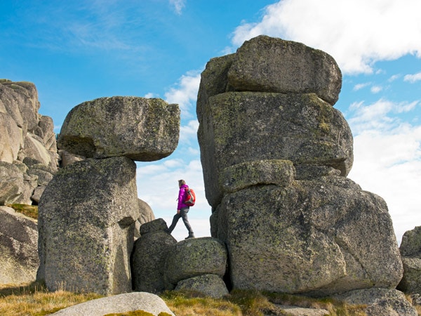 a woman walking along Ram Ranges Head, Kosciuszko National Park