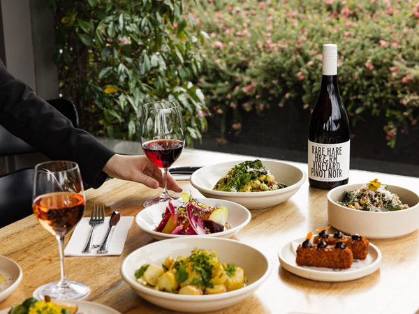 a spread of food and wine at Rare Hare