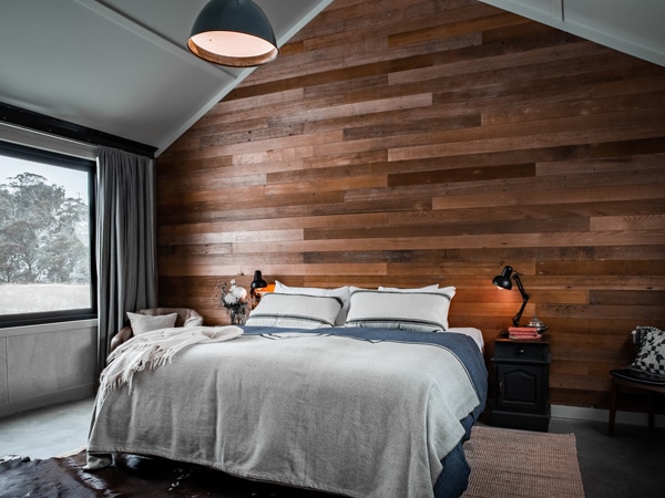 a rustic bedroom at Tinkersfield Hut