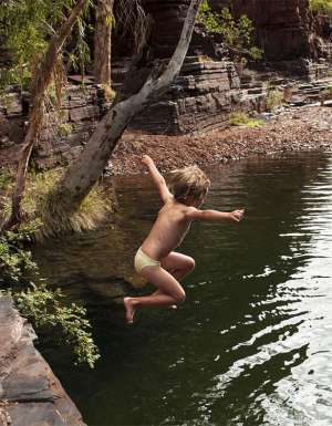 Kid jumps into Karijini National Park gorge