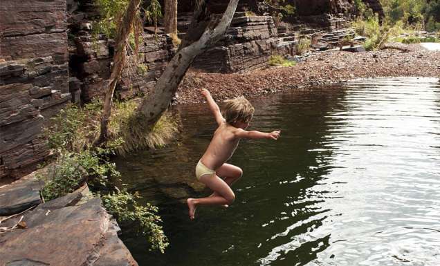 Kid jumps into Karijini National Park gorge
