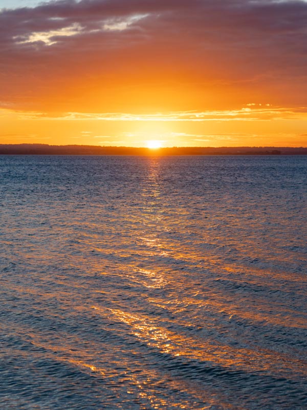 Sunset over the ocean on French Island