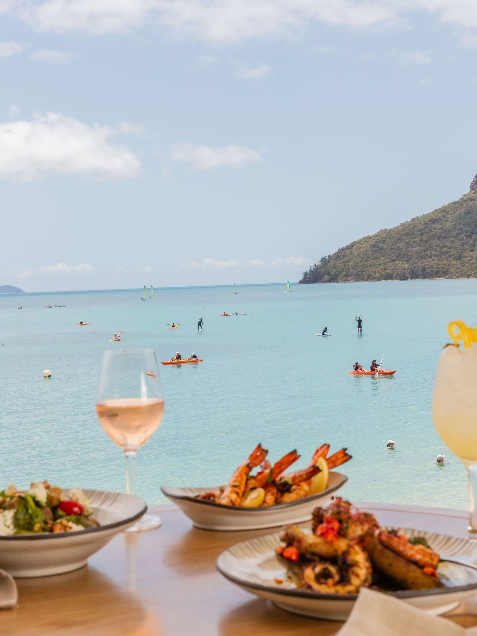 food and wine at Sails Restaurant overlooking Catseye Beach