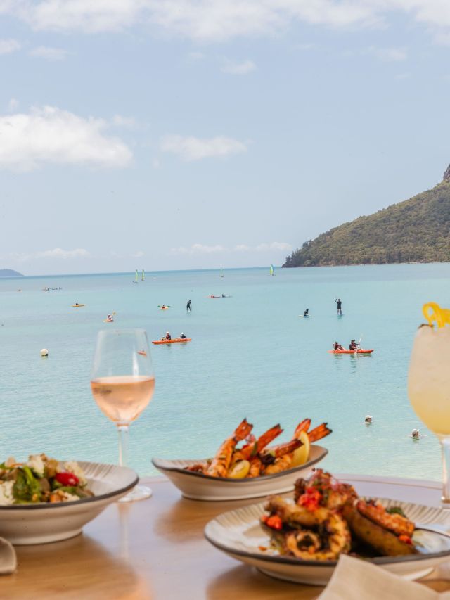 food and wine at Sails Restaurant overlooking Catseye Beach