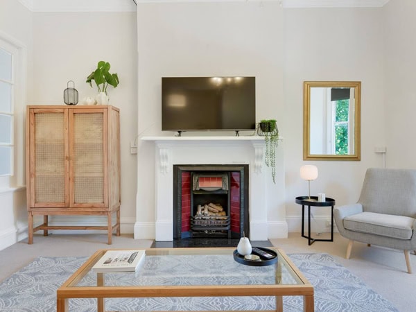 a look inside the living room of The Heart of Orange Airbnb