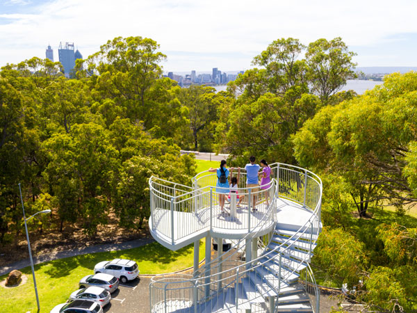 a family standing atop Kings Park Perth while admiring nature views