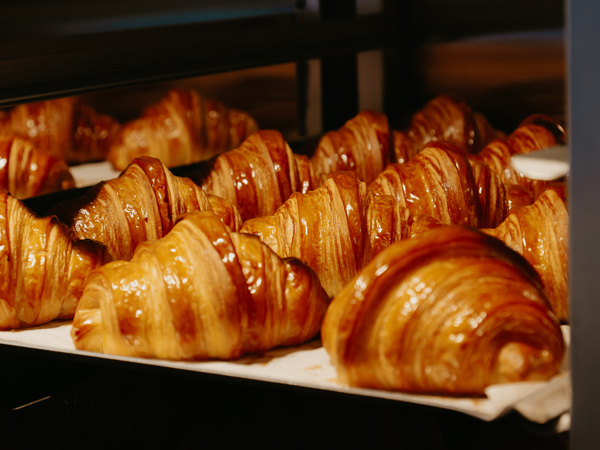 a rack of croissants at Lune Croissanterie