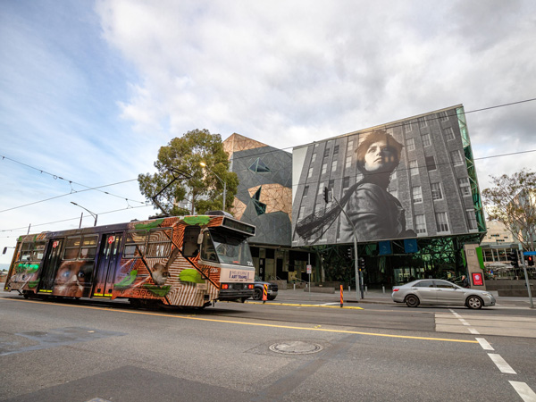 a tram passing by the National Gallery of Victoria