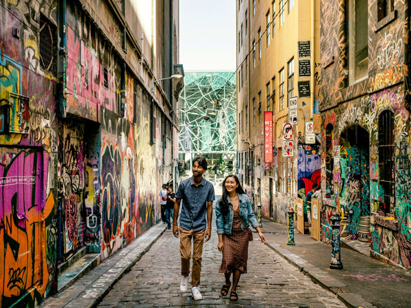 a couple admiring the street art along Hosier Lane, Melbourne