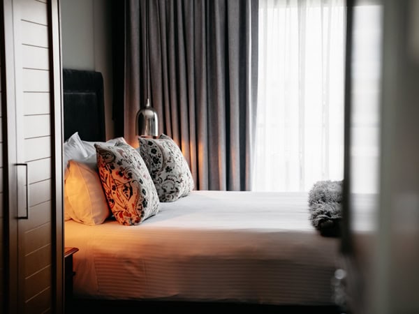 a close-up shot of the bed at de Russie Boutique Hotel
